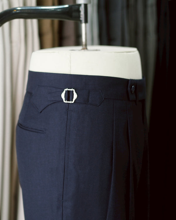 Navy Edge pleated belt trousers