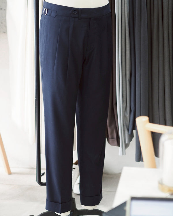 Navy Edge pleated belt trousers